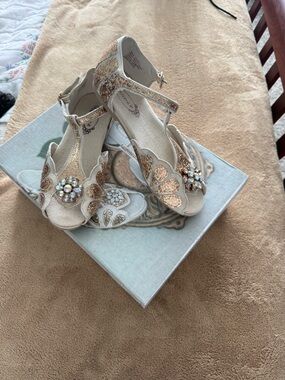 Joyfolie Champagne Glitter T-Strap Heels with Crystal Flower